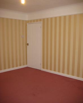 After — hallway and stairs decorated